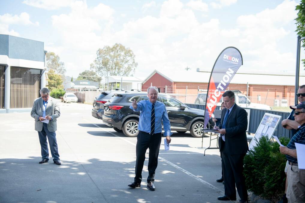 Auctioneer Andrew Dixon calls for offers for a large industrial property on Osburn Street in Wodonga, which sold at auction for almost $3 million on Friday, November 3. Picture by Tara Trewhella
