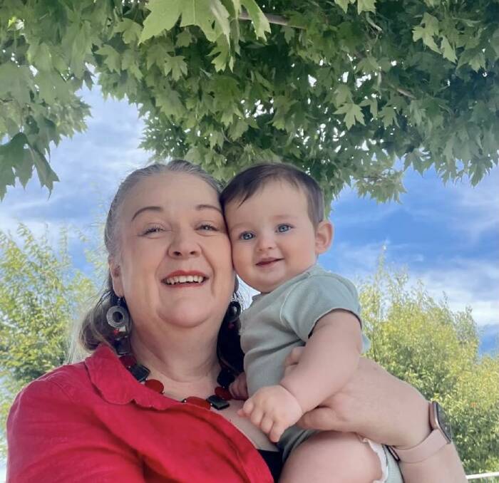 Rachel Anderson with her grandson nine-month-old Theo Field, who she says enjoys copying her dance moves. Picture supplied 