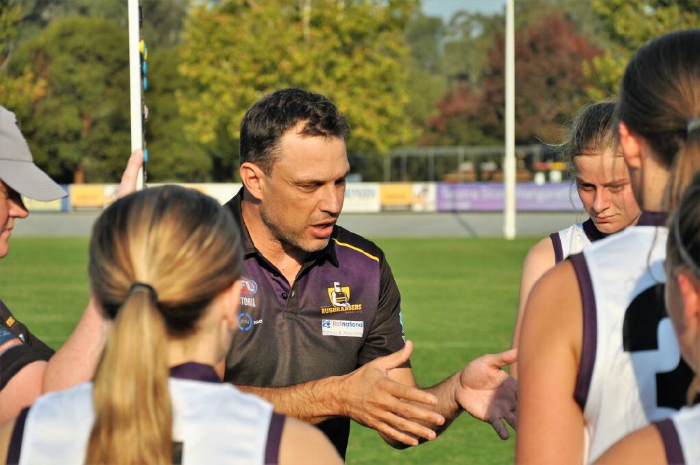 TALKING TACTICS: Murray Bushrangers girls' coach Sam Ahmet has a chat with his players during last weekend's clash with Sandringham Dragons. Picture: STEPHEN HICKS