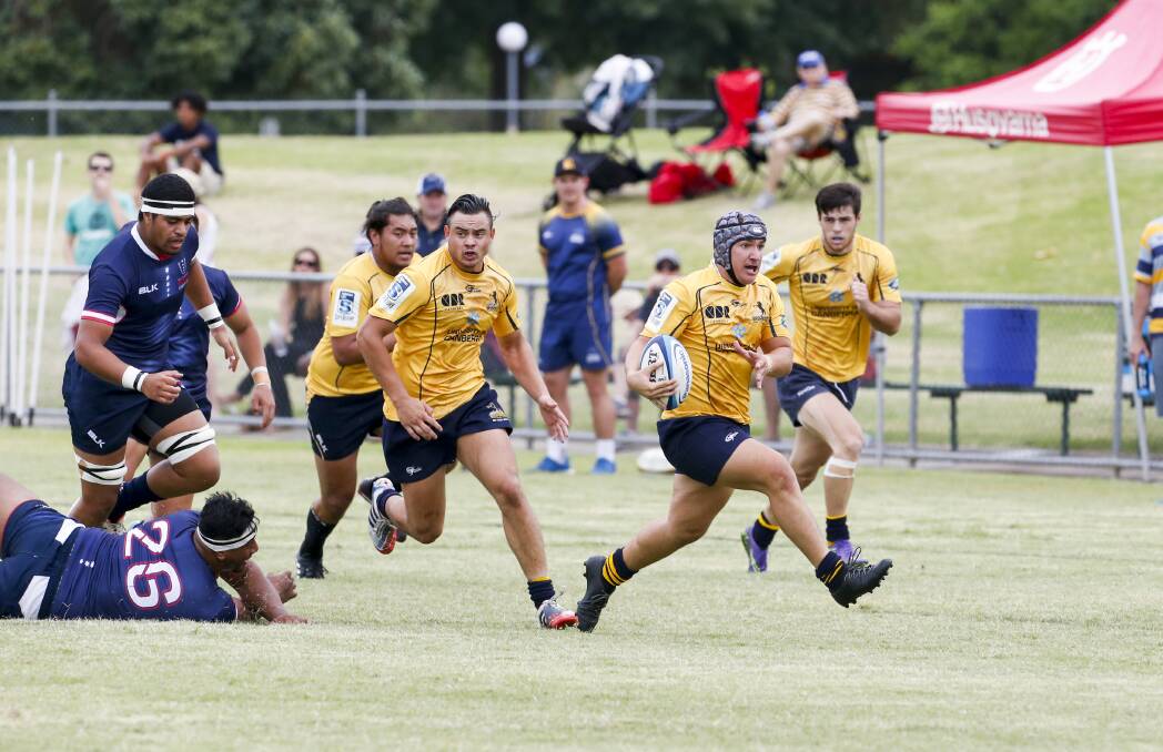 OPEN SPACE: Joel Astle breaks through the Rebels defence with Brumbies teammate Kuti Tahau looming in support at Greenfield Park on Saturday. Picture: SIMON BAYLISS