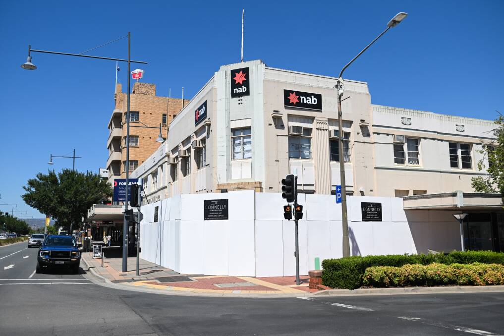 Signage has been placed around part of the Albury NAB building on the corner of Dean and Kiewa streets to prepare for the fit-out of NSW's first Daniel's Donuts store. Picture by Mark Jesser
