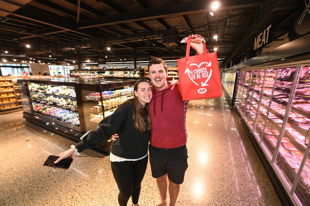 ALL SMILES: Baranduda couple Bianca Kennedy and Zac Redburn are already huge fans of the community's new IGA supermarket, which was officially opened on Saturday and will trade seven days a week. Picture: MARK JESSER
