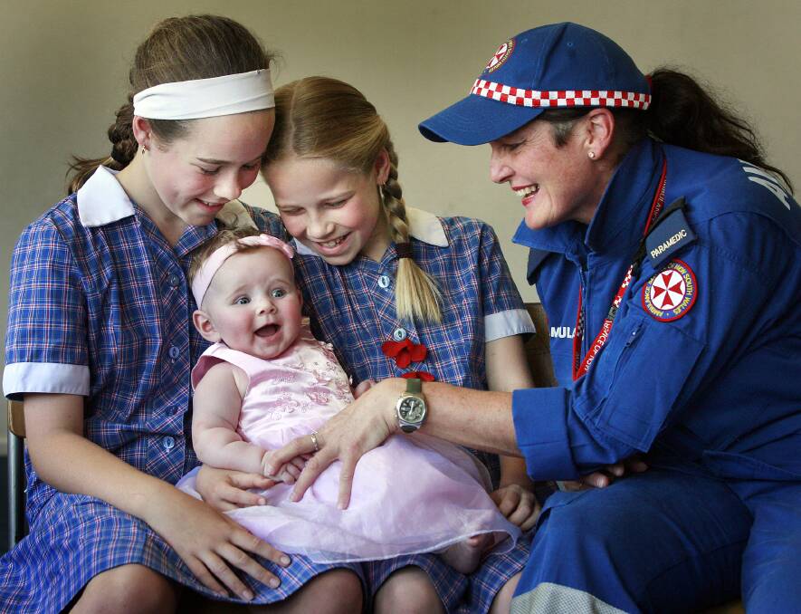 FLASHBACK: Laura Bishop, 12, Ella Bishop, 19 weeks, Caitlin Bishop, 10 and paramedic Fiona Dillon in 2008.