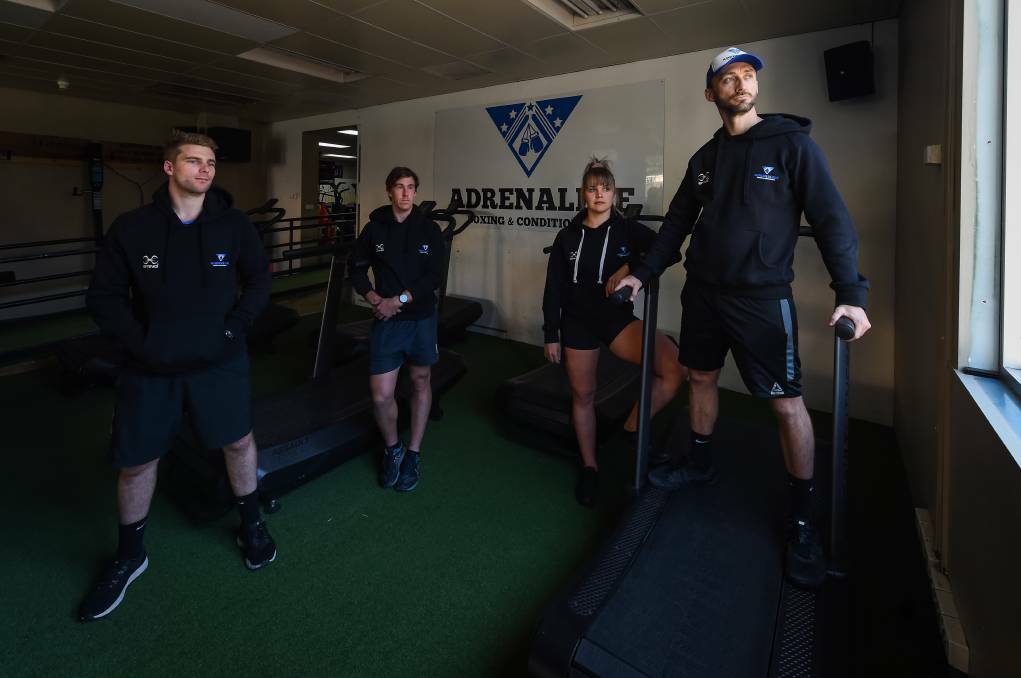 WHAT A DAY: Adrenaline Boxing and Conditioning trainers Stuart Wilcox (left), Tyson Logie and Brooke Pryse join co-owner Kade Brown after the gym was forced to close. Picture: MARK JESSER