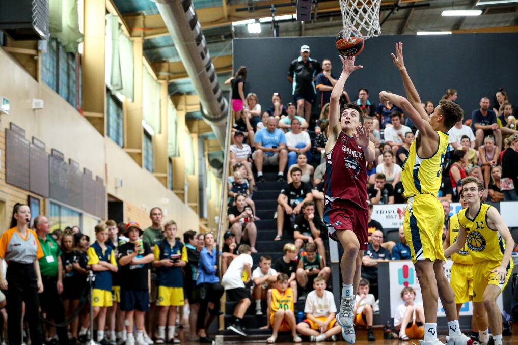 TO THE BASKET: Victorian Bushrangers' Christian D'Angelo is closed down by Victorian Goldminers' Dyson Daniels in this year's under-18 boys Australian Country Junior Basketball Cup grand final.