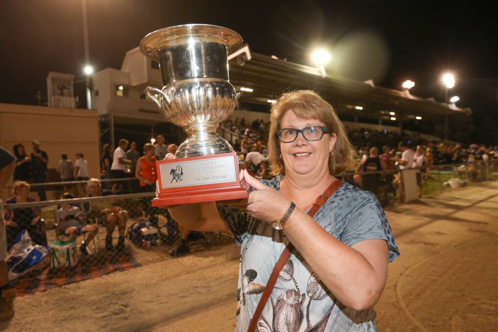 DELIGHTED: Our Summer Bay owner Jeanette Hill lifts the Albury New Year's Eve Cup.
Picture: JAMES WILTSHIRE
