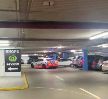UNDER INVESTIGSTION: A still from the footage of a Holden Statesman that rammed a police vehicle in the car park at Myer Centrepoint in Albury on Saturday before fleeing the scene.