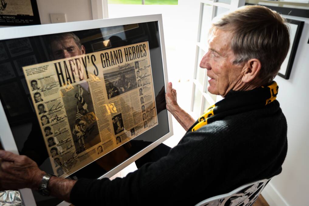 FOND MEMORIES: John Perry with a framed poster of the 1967 premiership team.