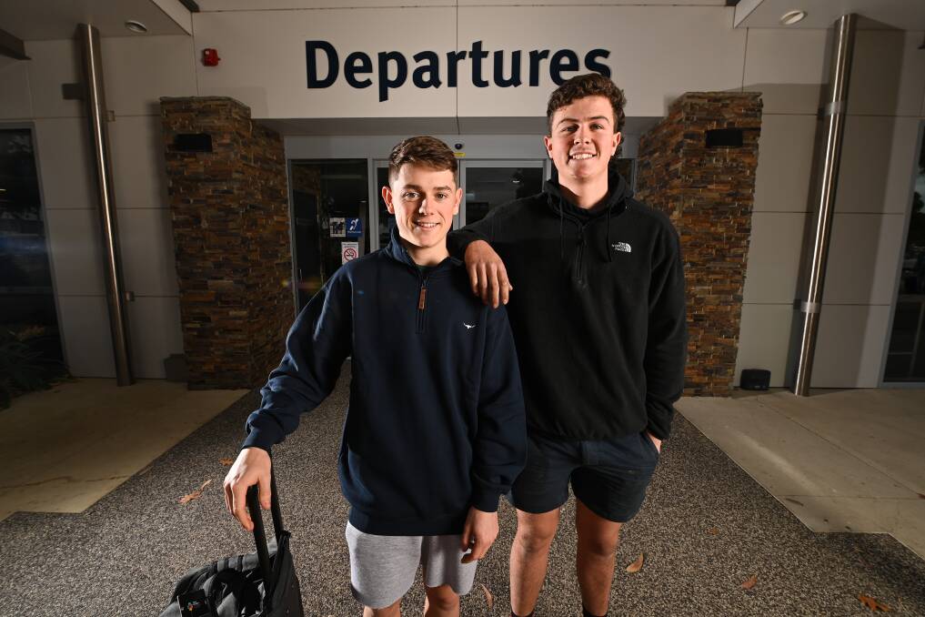 AWAY THEY GO: Albury's Paddy Parnell and Daniel Turner bid farewell at Albury Airport before beginning their AFL careers with Adelaide and Melbourne. Picture: MARK JESSER