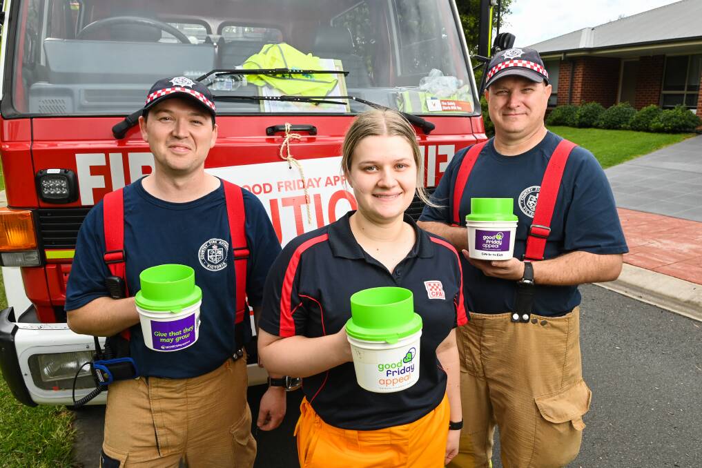 Baranduda CFA volunteers Brian Tyler, Alisha Wattie and captain Scott Schilling shaking tins for the Good Friday Appeal. Picture by Mark Jesser