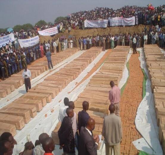 Mourners gather in 2004 around the coffins of more than 150 Congolese people killed at a United Nations refugee camp at Gatumba in Burundi. Picture supplied