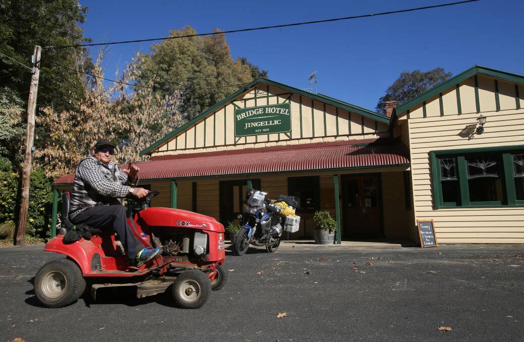 INCREDIBLE STORY: Rex Beaver arrives at the Bridge Hotel at Jingellic on his trusty ride-on mower.