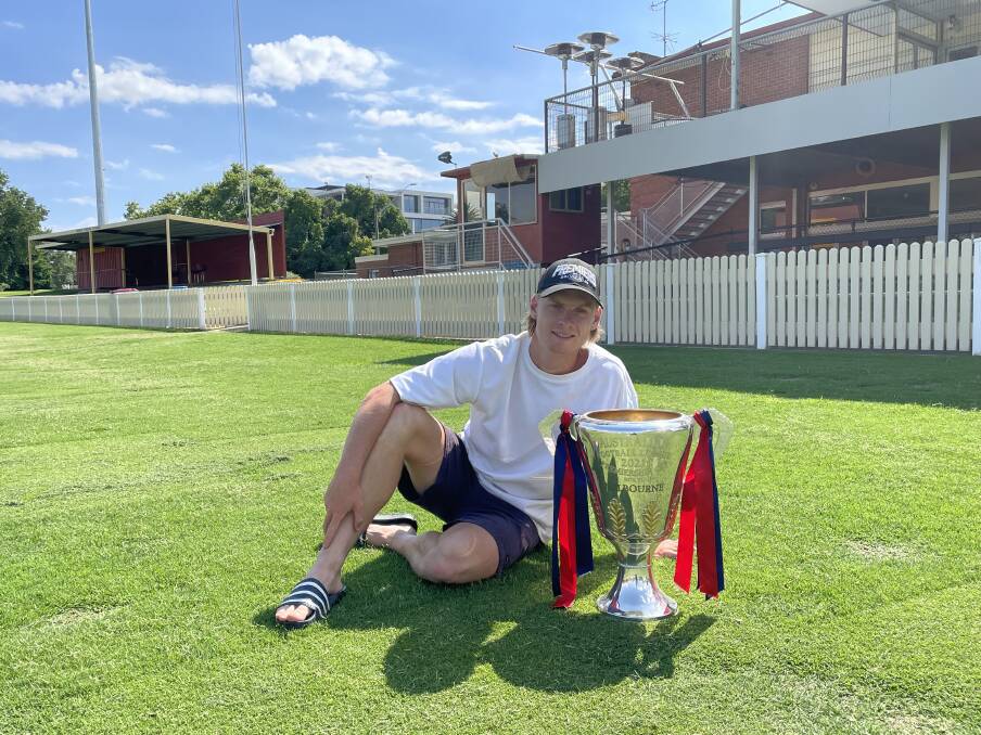 DEMON DELIGHT: Albury's Charlie Spargo shared the 2021 AFL premiership cup with
the Border's Melbourne fans at Albury Sportsground on Tuesday.