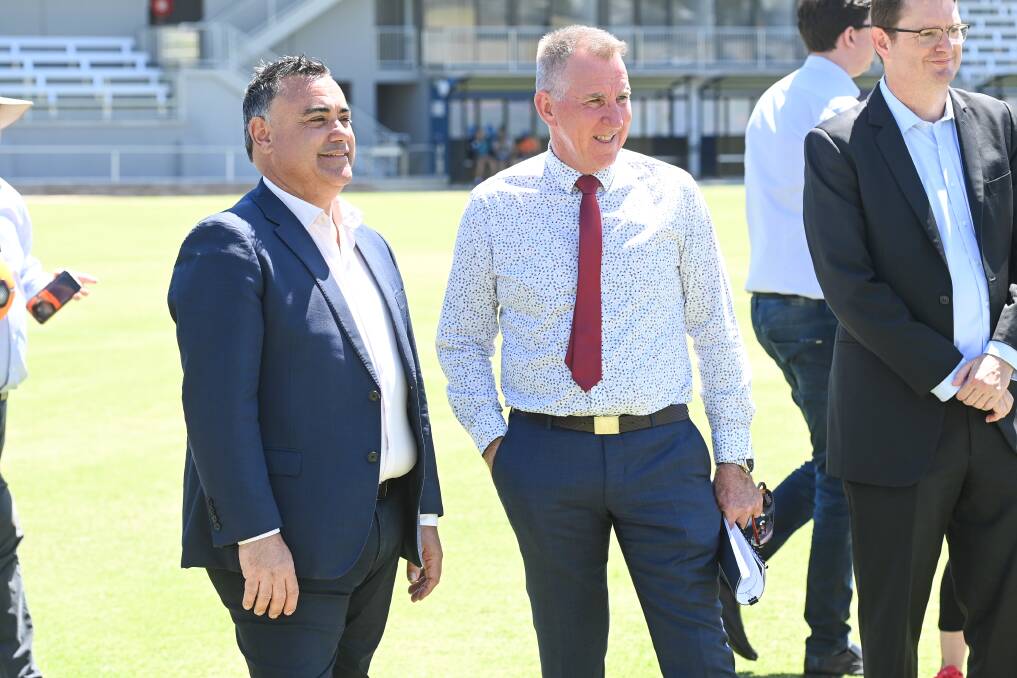 ALL SMILES: NSW Deputy Premier John Barilaro and Albury mayor Kevin Mack at Lavington Sportsground on Wednesday.