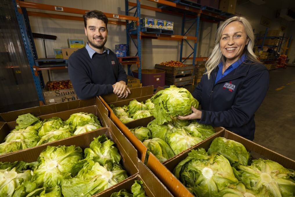 LIMITED: Arnold's Fruit Market general manager Ben Arnold and marketing and promotions manager Louise Arnold have continued to sell iceberg lettuce, but supply isn't meeting demand for the Wodonga retailer. Picture: ASH SMITH