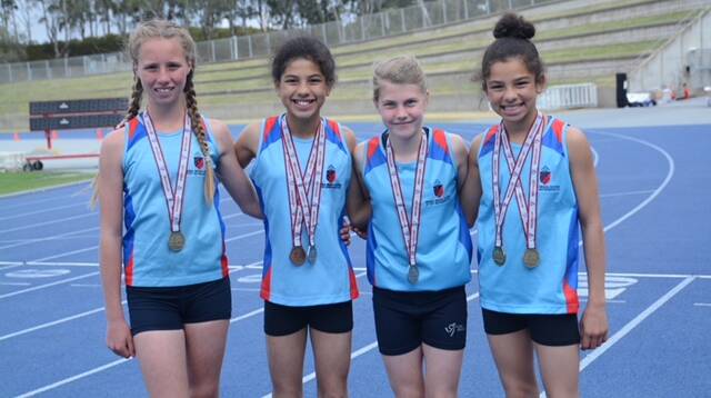 FAB FOUR: Scarlett Galvin, Aleira McCowan, Ashleigh Carty and Kijana McCowan won medals at the MacKillop Track and Field Championship at Sydney Olympic Park.