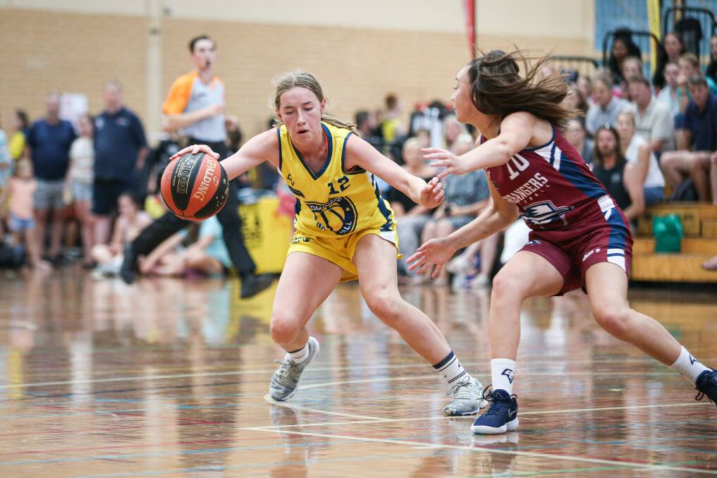 ANKLE-BREAKER: Victorian Goldminers' Rosie Todd takes on Victorian Bushrangers' Sienna Privitera in the under-18 girls gold medal game on Saturday. Picture: JAMES WILTSHIRE