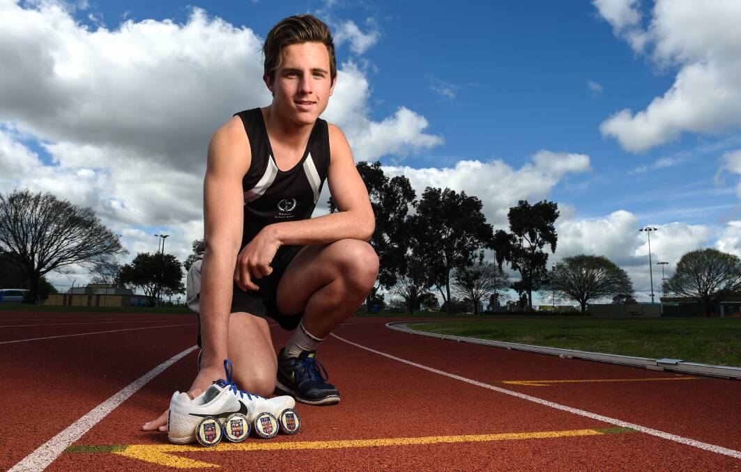 MAJOR HAUL: Albury teenager Declan Campion shows off some of the medals he collected during a another record-breaking season in athletics last year. Picture: MARK JESSER