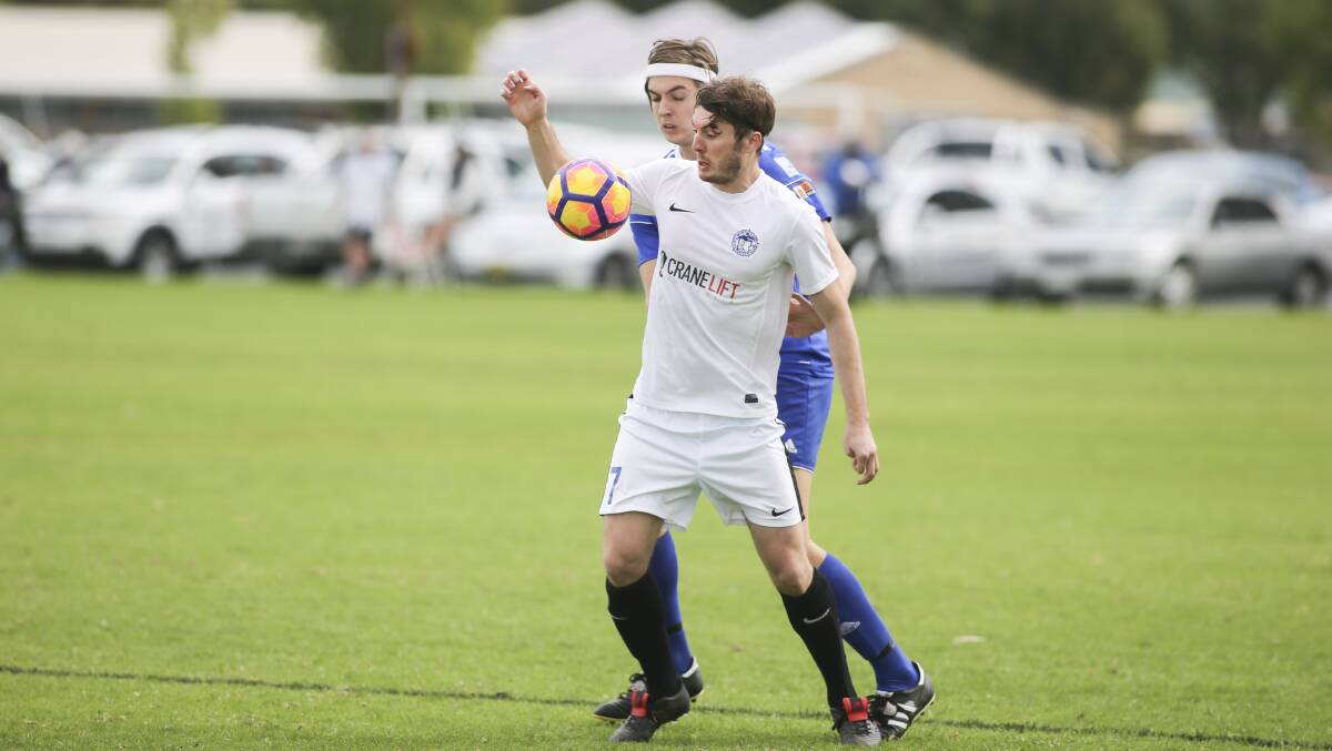 READY TO GO: Myrtleford's William Dennis brings the ball to ground during the Savoy's clash with Albury City earlier this season. Picture: SIMON BAYLISS