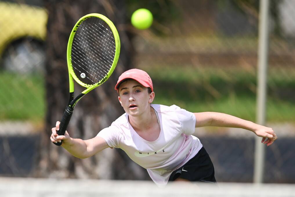 FULL STRETCH: Albury's Lara Meagher reaches for a return in her opening round win in the under-12 girls singles at Wodonga Tennis Centre on Wednesday.
