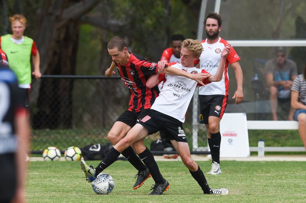 DETERMINED: Jordan Hore (right) in action for Murray United in a practice match against Wangaratta last year. The talented midfielder has joined the Devils for the 2020 AWFA season but still has aspirations to go further in the sport.