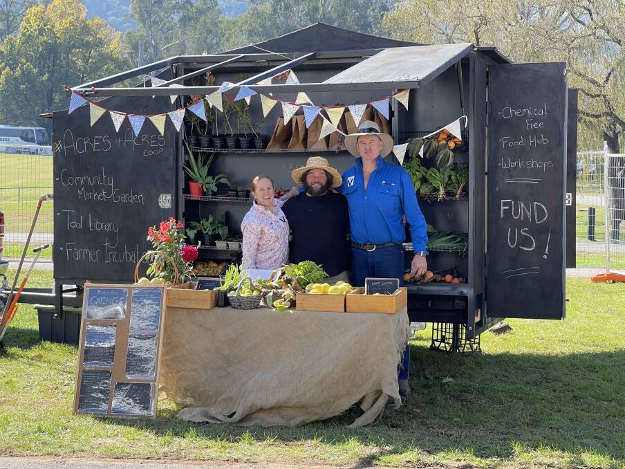 TEAM EFFORT: Josh Collings (middle), with Shelley Waters and Matthew Gledhill, shows off some of Acres to Acres's fresh produce.