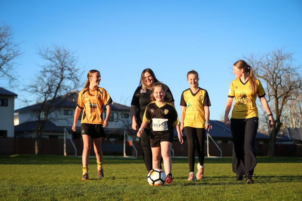 CUP FEVER: Albury Hotspurs' Daisy Tuksar, 13, Jess Briggs, Harper Howard, 7, Elisha Wild, 12, and Grace Corrigan, 16, are part of the club's female teams playing in cup finals at Jelbart Park on Sunday. Picture: JAMES WILTSHIRE
