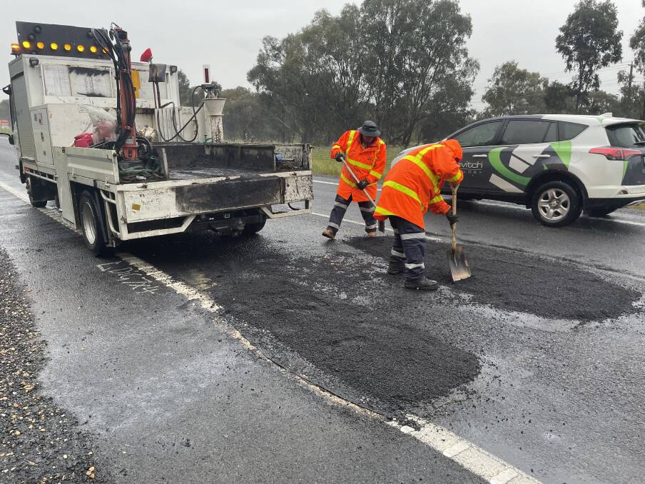 Work is underway to patch up two major potholes between Melrose Drive and McKoy Street on the Hume Freeway at Wodonga. Picture by Victoria Ellis
