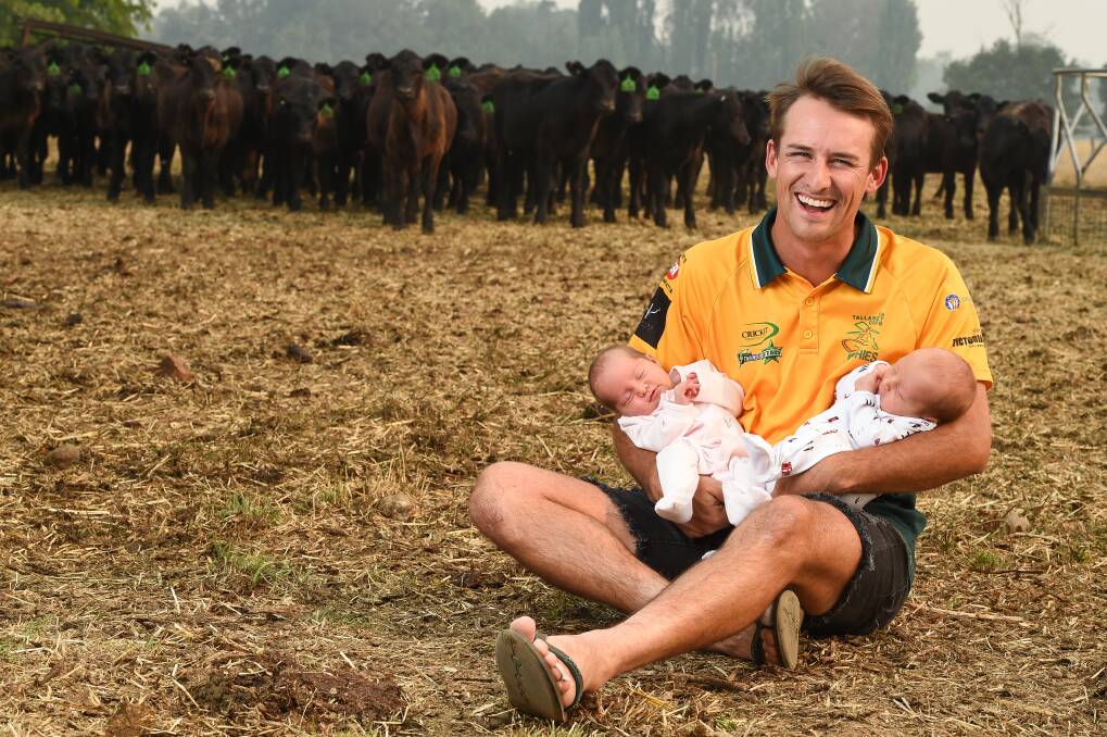 HANDS FULL: Tallangatta cricketer Sam Stephens with his four-week-old twin babies Oakleigh and Oliver at home in Tintaldra. Picture: MARK JESSER