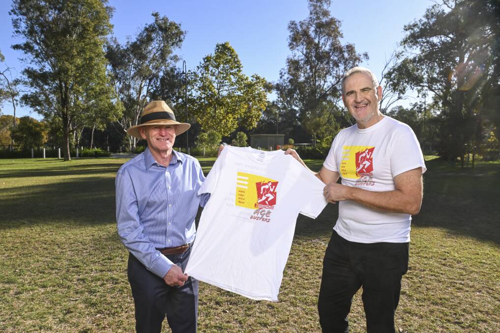 Nail Can Hill Run organising committee member Paul Gibney and six-time winner Pat Scammell would love to see the event return to its original finishing point at Noreuil Park in Albury. Picture by Mark Jesser
