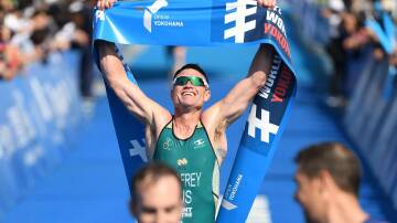 VICTORY: Albury's Justin Godfrey with a vital win in the World Triathlon Championship Series event in Yokohama earlier this month. Picture: TRIATHLON AUSTRALIA