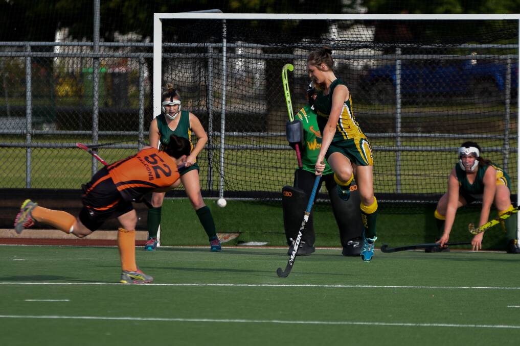 ON TARGET: Falcons' Jess Madden flicks a shot on goal against Wombats.