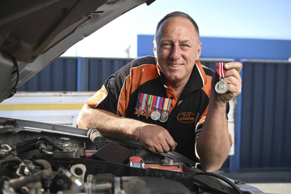 Phil Bullivant with his Australian Service Medal and his grandfather's war medals. Mr Bullivant says "I was proud of my service to the country, but prouder my community work" as he prepares for Stars of the Border Dance for Cancer. Picture by Mark Jesser