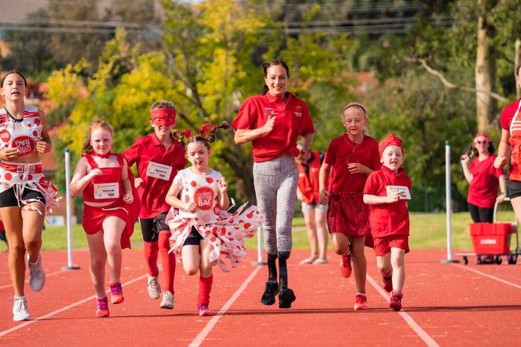WHAT A MOMENT: Border Paralympian Eliza Ault-Connell spent time with Albury Little Athletics Centre athletes as part of community round on Saturday. Picture: SIMON DALLINGER