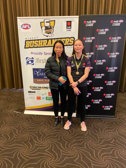 TOP EFFORT: Daisy Pearce Medal winner Aurora Smith with mother, Hyunsook, after she was crowned the Murray Bushrangers girls 2021 best and fairest on Sunday. Picture: STEPHEN HICKS