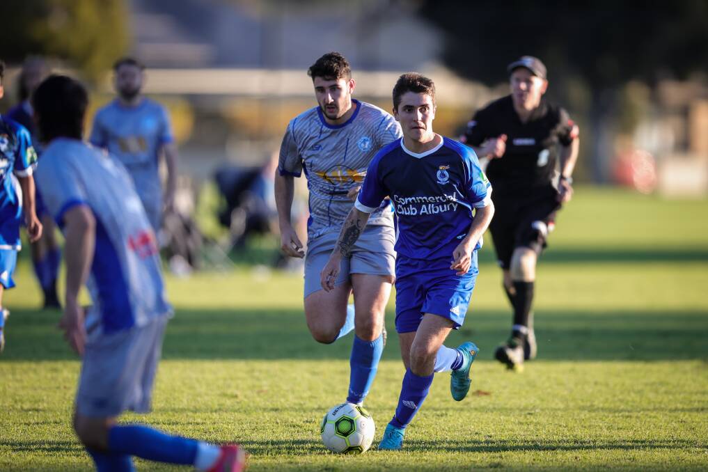 DETERMINED: Paris Maw gives his all for Albury City in its 4-2 victory against Myrtleford. City hosts Wangaratta on Sunday. Picture: JAMES WILTSHIRE