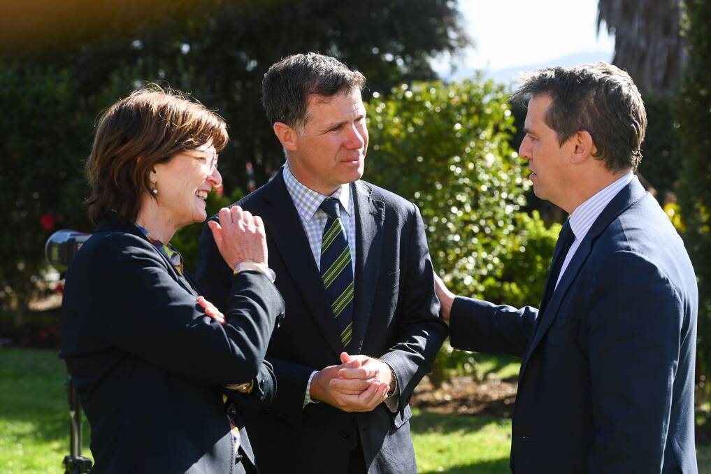 Victorian and NSW health minister Mary-Anne Thomas and Ryan Park speak with Albury MP Justin Clancy at Albury hospital in September 2023. Picture by Mark Jesser