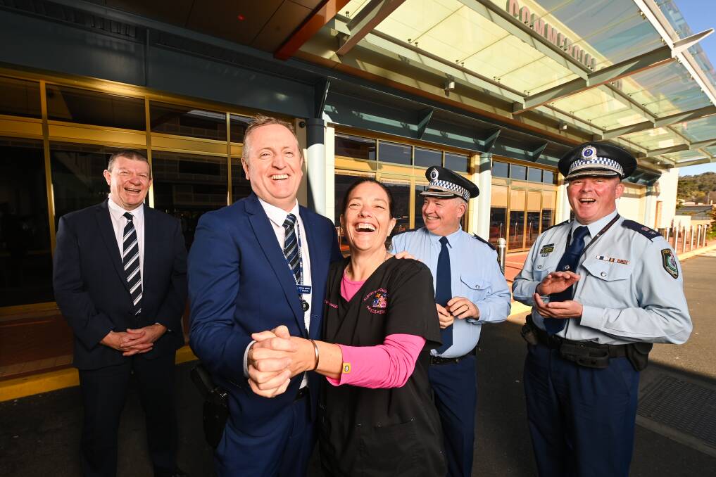 FUN: Detective Sergeant Troy Martin dances with paediatric nurse unit manager Sam Peet to cheers from Commercial Club general manager Jeff Duck, Chief Inspector Scott Russell and Superintendent Paul Smith. Picture: MARK JESSER