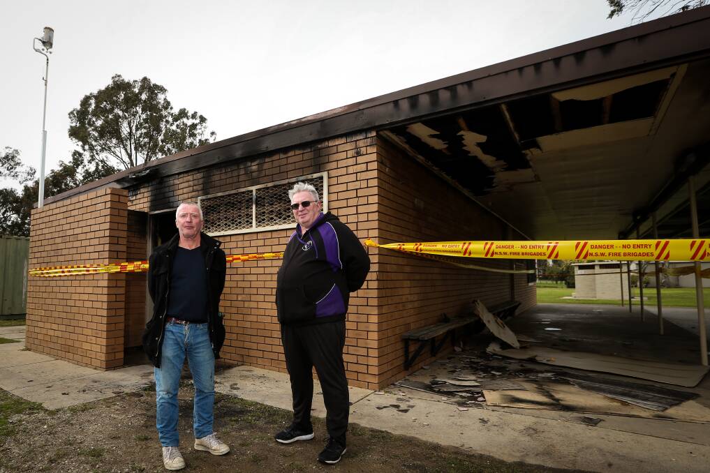 SETBACK: Melrose Football Club president David Pye and committee member Glenn Wilson assess the damage caused by a fire at the club rooms at Lavington's Melrose Park on Monday night. Picture: JAMES WILTSHIRE