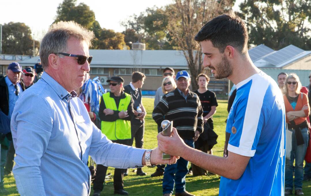 TOP HONOUR: Matt Park is presented with the player of the match award in Sunday's cup final by Albury mayor Kevin Mack. Pictures: SIMON BAYLISS
