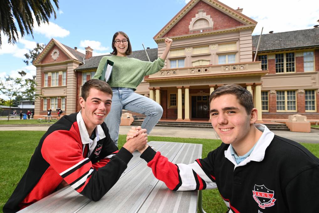 Albury High School dux Lachlan Carty, 18, Ryan Yensch, 17, and Amelia Spinks, 17, celebrate their ATAR results on Thursday. Picture by Mark Jesser