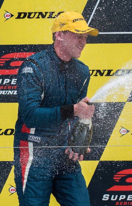 MAGIC MOMENT: Boys celebrates on the podium after his impressive Super2 victory at Newcastle in 2019.