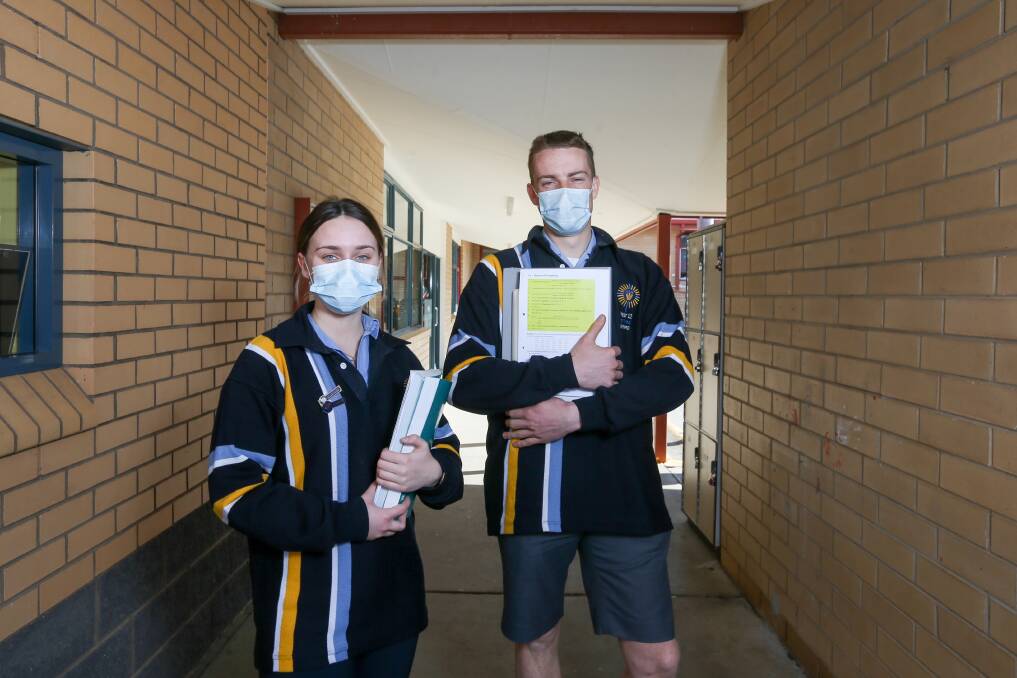 HOME: Catholic College Wodonga school captains Nichola Barrett and James McKenzie-McHarg as they prepared to return to online learning in August. Picture: TARA TREWHELLA
