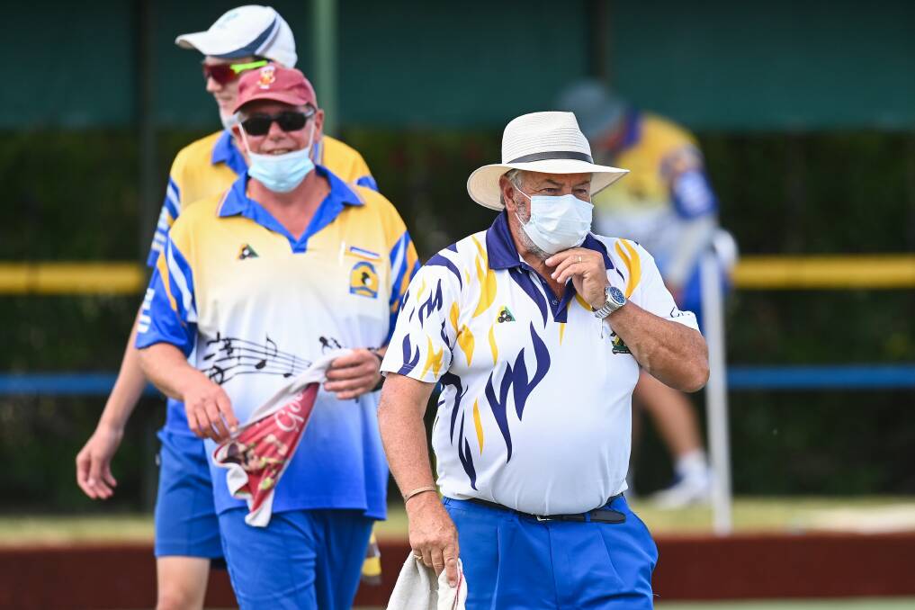 MASKED NO MORE: Kiewa Valley's Ron Keane bowls in a mask in an Ovens and Murray pennant clash this month. Mask rules have been relaxed across Victoria when outdoors.