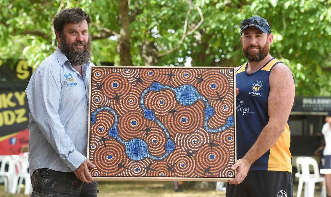 SPECIAL: Albury-Wodonga Steamers president Mick Raynes and senior coach Mat Coombes with the artwork painted by Dan Clegg. Picture: MARK JESSER