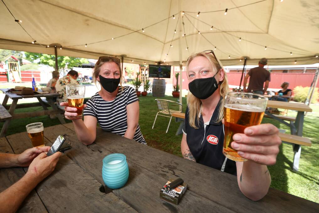 CHEERS: Linsey Bailey and Claire Stiler enjoyed the Melbourne Cup from the beer garden of Chiltern's Telegraph Hotel. Picture: JAMES WILTSHIRE