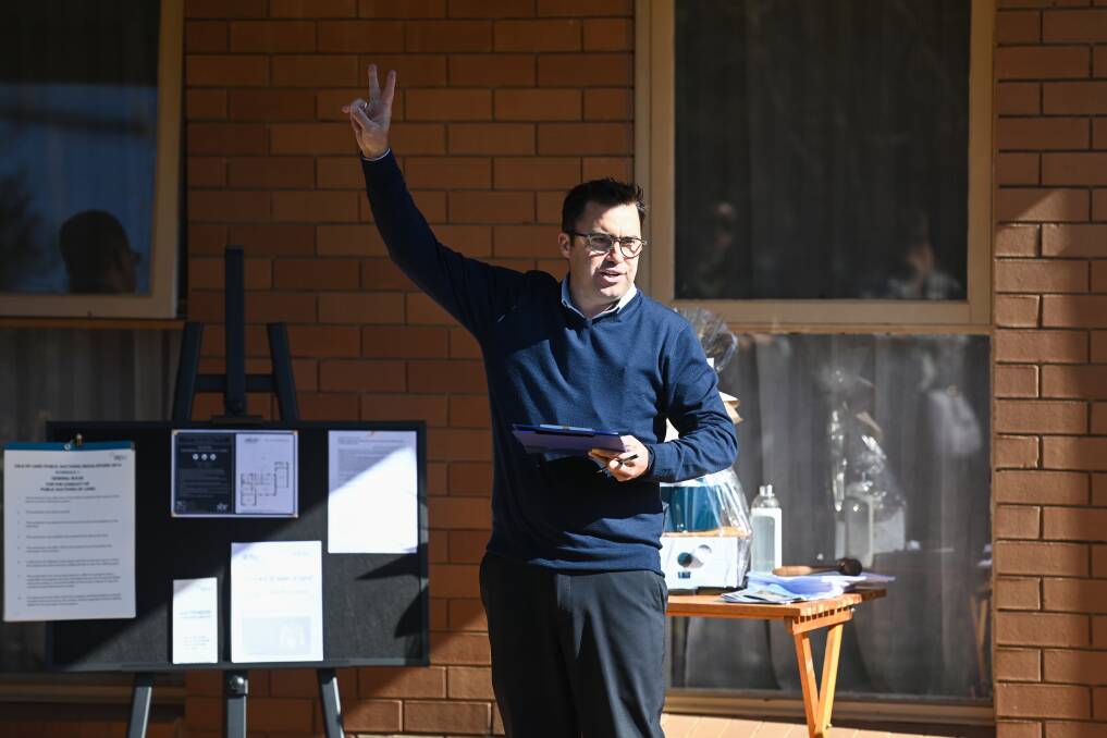 ANY TAKERS: Sell Buy Rent auctioneer Clint Ilsley calls for offers for a townhouse on Huons Hill Road in Wodonga.