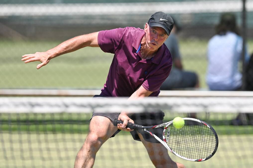 CRISP VOLLEY: Hayden McIntosh looks in complete control at the net during his pennant match at the Albury grasscourts. Picture: MARK JESSER