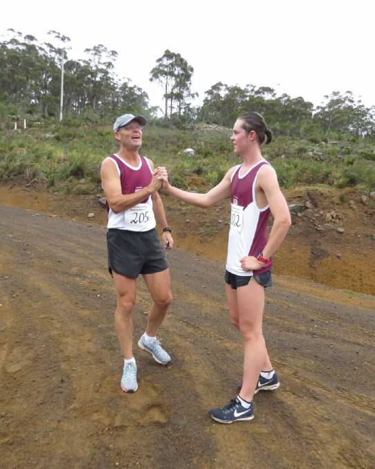 STEEP TASK: Digby Race and Alex Race-Stelling congratulate each other after completing a tough Mount Wellington course at the Australian Mountain Running Championships in Hobart.