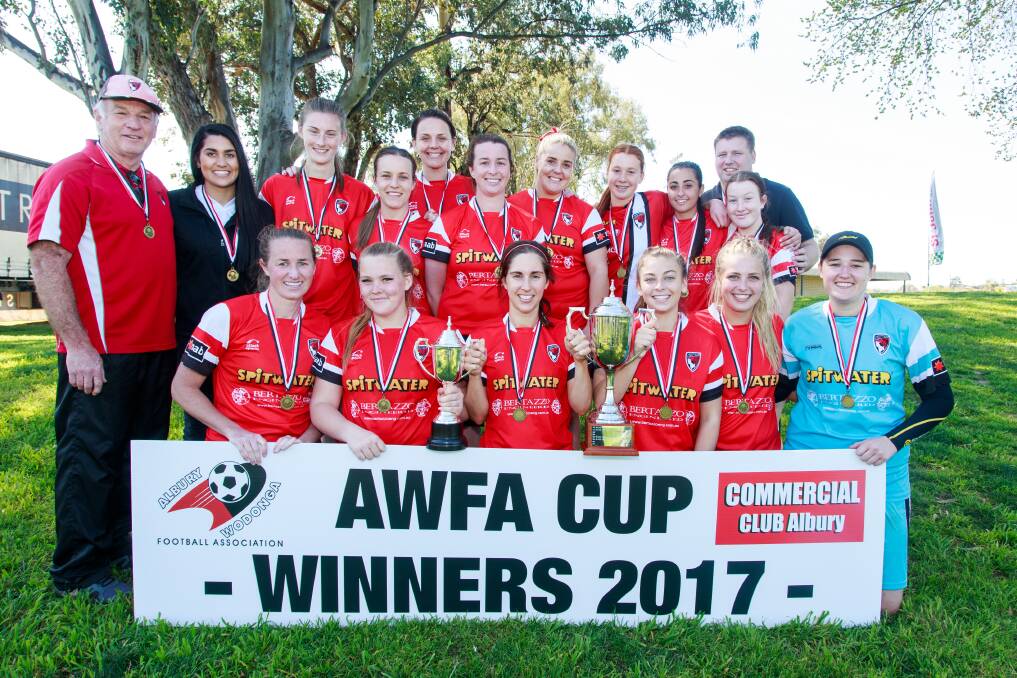 Stephen Hayes with his team after winning the 2017 senior women's cup final.